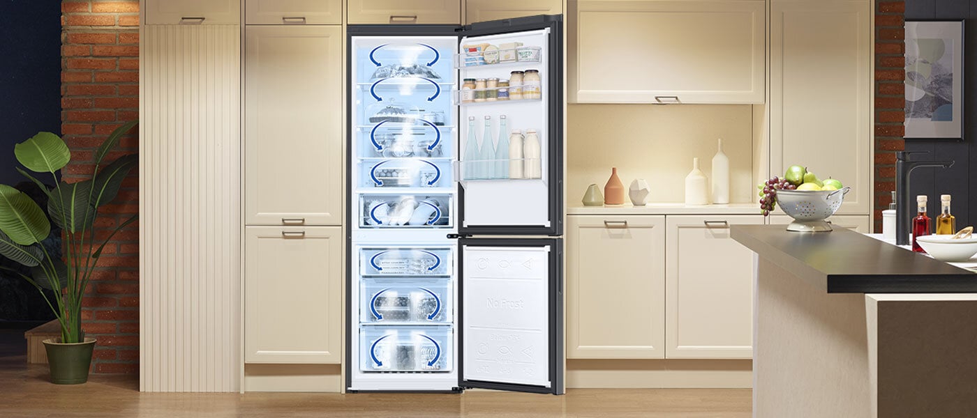 Grafika obrazuje rozprowadzanie chłodnego powietrza po komorach chłodziarki i zamrażalnika