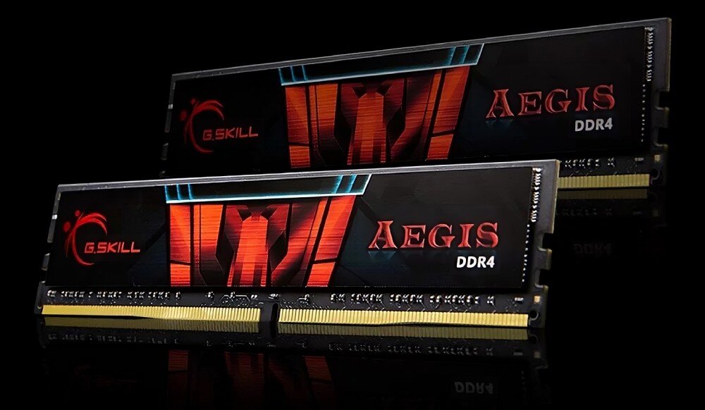 Komputer XQUANTUM XQR5R16S1TB-XA30WP Dwa moduły pamięci RAM DDR4 marki G.SKILL z serii Aegis ustawione na czarnym tle, z widocznym czerwono-czarnym wzorem na etykiecie, pamięć RAM, taktowanie, opóźnienia, profile XMP